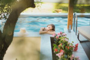 woman in the pool posing for the camera