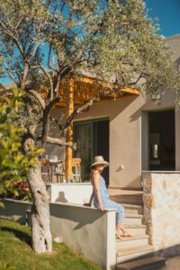 woman sitting on the stairs outside